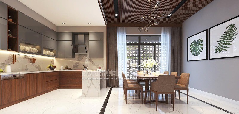 Thiết kế nội thất phòng bếp liền phòng ăn sang trọng, độc đáo với nội thất gỗ chủ đạo từ tủ bếp, bộ bàn ghế, tường ốp gỗ tại biệt thự, nhà phố Vinh, Nghệ An. Thiết kế biệt thự