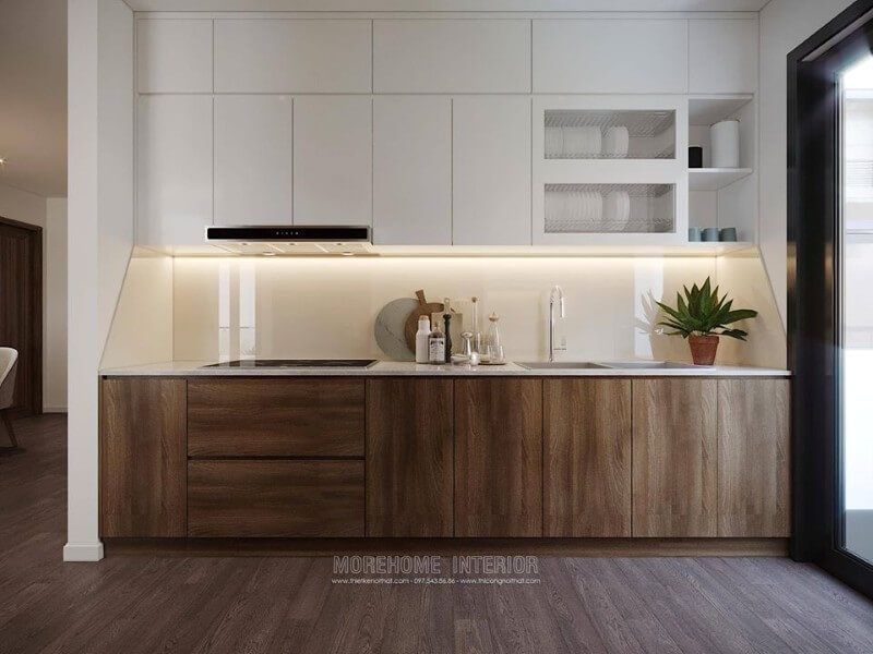 Tủ bếp bằng nhựa acrylic tone màu trắng, có thiết kế kịch trần và nhiều ngăn để tạo ra một khu vực lưu trữ đồ lớn cho căn bếp.
